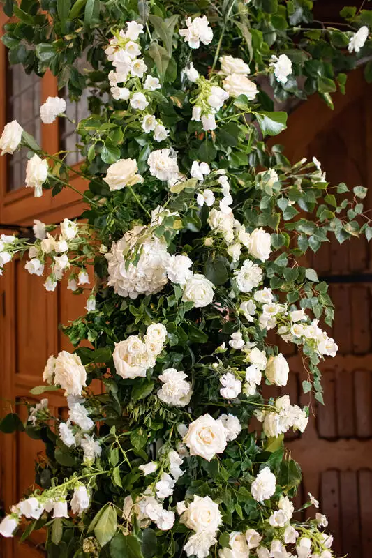 Destination wedding in Ireland at Adare Manor, County Limerick — close-up detail of white ceremony florals arranged for the wedding ceremony.
