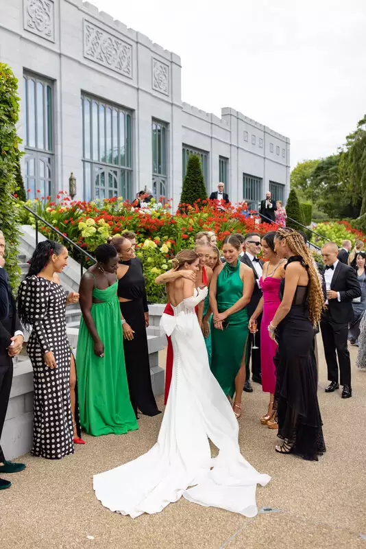 Destination wedding in Ireland at Adare Manor, County Limerick — bride celebrating and embracing her close friends during the drinks reception.