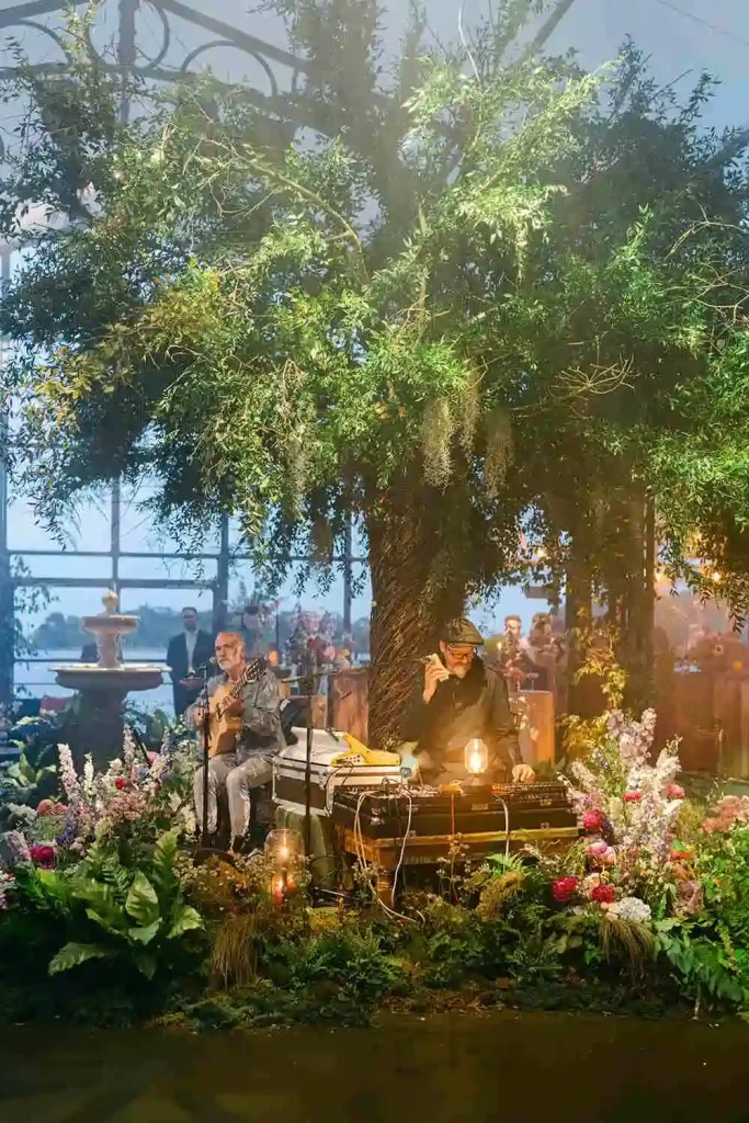 Irish destination wedding at Ashford Castle, County Mayo — musicians performing under a custom willow tree installation during the wedding reception celebration.
