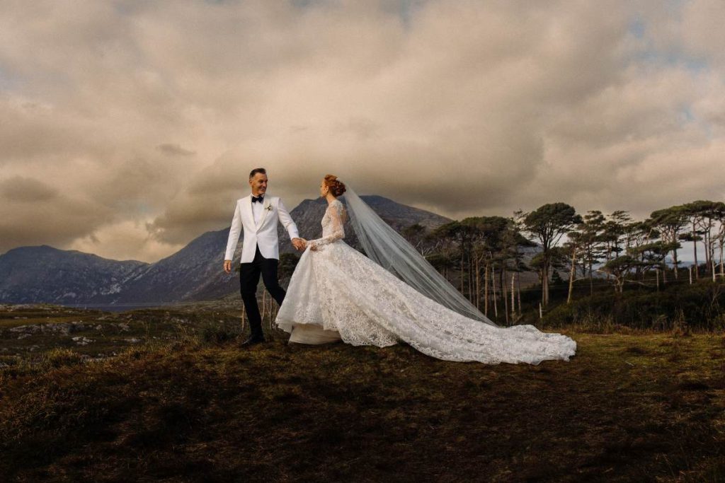 Destination wedding in Ireland at Ballynahinch Castle, County Galway — bride and groom portraits on the Connemara moorlands during an outdoor celebration.
